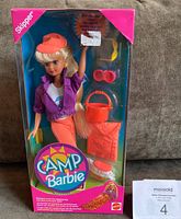 Front of the packaged Camp Barbie doll showing the doll in outfit and accessories with original pricing sticker on display window.
