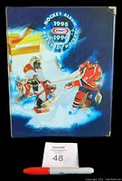 Front cover of the presentation binder with 1995-96 Kraft Hockey Album graphics showing hockey players in action.