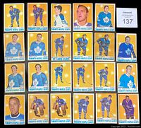 Photo showing 20 hockey cards mainly featuring Toronto Maple Leafs players posed or action shots with a yellow background, including George Armstrong, Brian Glennie, Ron Ellis, Jim Harrison, Norm Ullman, Garry Monahan, Rick Ley, Mike Walton, Paul Henderson. Includes duplicates.