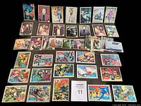 Full lot of 44 Batman cards arranged in rows showing front artwork from all series.