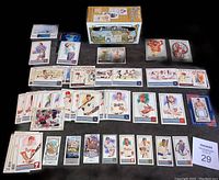 Overview of 49 Topps Allen & Ginter cards laid out alongside the original box, displaying a mix of baseball players and a relic card.