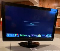 Front view of 29 inch Vizio TV showing smart TV interface with Hulu Plus app icon and 'No Signal' message on screen.