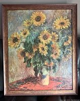 Front view of the framed oil painting showing the sunflower bouquet and burl wood frame.