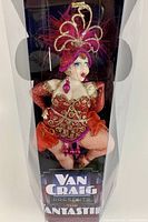View of full ornament in original box showing label and figure