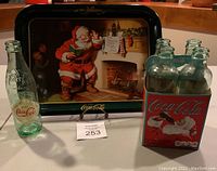 Full lot with metal tray, single vintage Coke bottle, and 5-pack bottle carrier with 5 bottles.