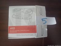 Box of A10 active noise cancelling earbuds showing product image and features.