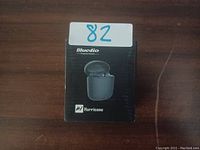 Box of Bluedio Hurricane wireless earbuds showing product image and branding on front.