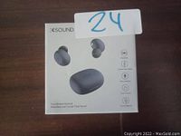 Photo of K-Sound true wireless earbuds retail box on wooden surface, showing product image and feature icons.