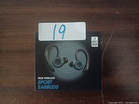 Box of true wireless sport earbuds showing product image and IPX7 waterproof rating