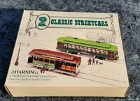 Top view of the closed box showing illustration and labeling for 2 classic streetcars.