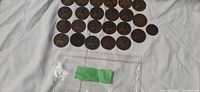 30 British coins from 1901 shown face up with Britannia designs.