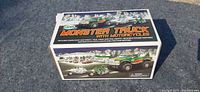 Front and top view of the sealed 2007 Hess Monster Truck with Motorcycles box with graphics showing the toy set.