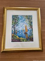 Full view of the Autumn Sails serigraph artwork by Dimitri Polak in gold frame on wooden floor