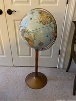 Front view of standing globe showing North and South America and part of Europe and Africa.