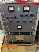 Front view of the World Radio Laboratories Globe King Model 500A transmitter showing analog meters, multiple rotary knobs, toggles and switches with labeling for various controls.