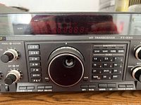 Front panel view showing digital display, tuning knob and mode buttons