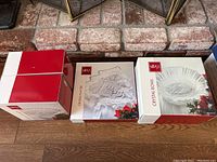 Three Mikasa boxes showing the crystal bowls, bonbon pedestals, and tree-shaped platter