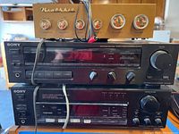 Front of Heathkit WA-P2 atop two Sony units showing faceplates and controls