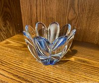 Front angled view of the crystal bowl showing the flower petal shape and slight blue tint at the base.