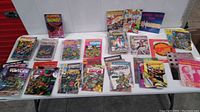 Full tabletop display of mixed comics and magazines