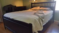 Wide angle photo of the full bed frame showing overall structure and finish