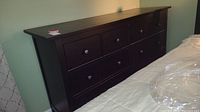Front view of the eight drawer dresser showing the espresso finish and drawer arrangement