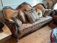 Front view of full sofa with five accent pillows