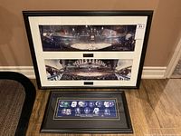 Shows three framed prints, two panoramic hockey photos in a large black frame and a smaller framed print with historical jerseys horizontally arranged.