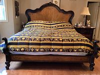 Front view of king size bed with bedding