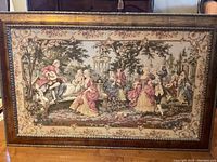 Full view of tapestry and gilt wood frame showing overall design and condition