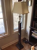 Full side view of floor lamp showing overall height, base and shade