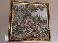 Full frontal photo showing the entire framed tapestry artwork with measurement tags indicating size of 33x33 inches.