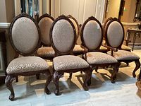 All eight chairs arranged in two rows showing overall set.