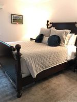 Angled front view of assembled bed showing headboard, footboard and side rails