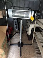 Full view of heater assembled on tripod stand