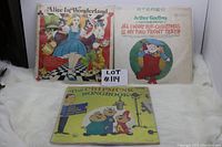Three vintage illustrated vinyl LP album covers, including Alice In Wonderland story, Arthur Godfrey Christmas songs, and The Chipmunk Songbook with Alvin and the Chipmunks characters.