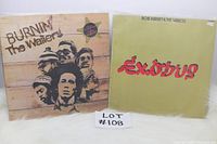 Two Bob Marley & The Wailers vinyl LP albums: 'Burnin'' and 'Exodus' with visible wear on album covers.