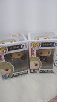 Front view of Joe Elliott (#147) and Phil Collen (#150) Funko Pop vinyl figures in original packaging.