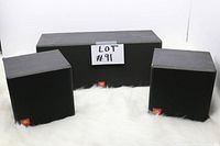 Front view of three JBL Flix1 speakers: one center channel and two surround speakers on a white surface with the lot number displayed.