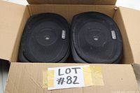 Two Pioneer 2-way car speakers inside a cardboard box showing front protective grills and the Pioneer brand badge on each speaker.