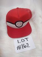 Front of hat showing red color and central Pokeball design