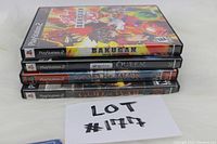 Stacked PlayStation 2 game cases showing titles: Bakugan Battle Brawlers, SingStar Queen, God of War, God of War II.