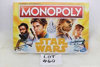 Front box of Star Wars Monopoly board game featuring main characters and branding.