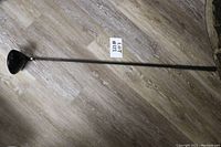 Full view of the Tour Edge Bazooka 370 golf driver club showing the full length of the shaft and club head.