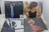 Four vinyl LP album covers featuring Stevie Nicks, Pat Benatar, The Pretenders, and Janet Jackson, placed on a white surface for display.