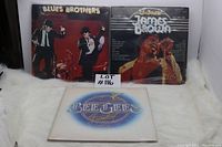 Three vinyl LPs: Blues Brothers, James Brown, Bee Gees front covers displayed.
