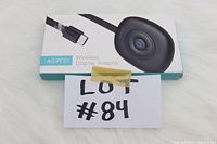 Photo of the AGPTEK Wireless Display Adapter box showing minor wear and an image of the adapter on the front.