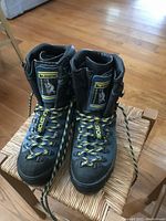 Front view of both La Sportiva mountain boots, showing the blue suede material, yellow/black laces and logos on tongues.