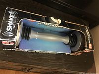Shake Weight dumbbell in packaging showing the design and branding