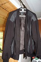 Black Premiere Collection men's sweater with charcoal grey leather trim, size large, showing front open view with lining visible.